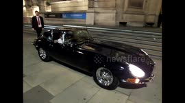 An E type Jaguar formerly on display outside the museum   leaves  the V&A Revolutions Exhibition PV