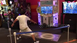 Watch this guy really go for it on a dance arcade game in Tokyo