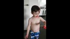 'Cheeky' toddler blames sister for covering him in lipstick