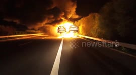 Car transporter bursts into flames, destroying 18 cars