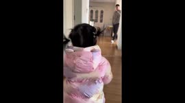 Father dodges daughter hug as she tumbles to floor