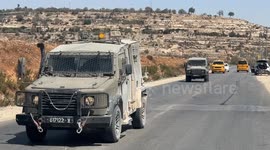 Israeli forces raid towns near Jerusalem, block key roads