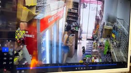 Smoking woman's face engulfed by flames as lighter explodes