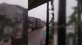 Indonesia: Indonesian Building Collapses Into Flooded River