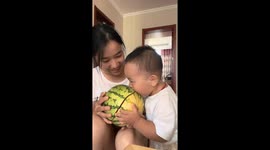 Baby takes a bite of watermelon with unexpected crack in Jiangsu, China