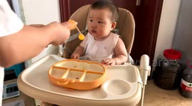 Baby gets squirted with juice in Shanghai, China