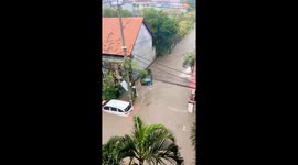Cars washed away during severe floods in Bali