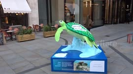 Tusk Turtle Trail 2025 - green spot of Trevor The Turtle by Magda Archer calls for ocean conservation at St James Market