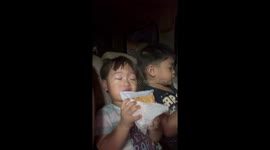 Toddler is seriously into his food on car ride home