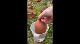 Thumb-Controlled Watering Pot