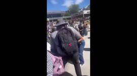 Crowd flee indoors following Charlie Kirk's fatal shooting at Utah Valley University