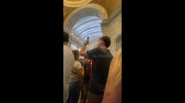 Charlie Kirk shooting sees supporters sing national anthem at vigil in Utah