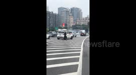 Woman stops car in middle of highway to perform hula hoop exercises