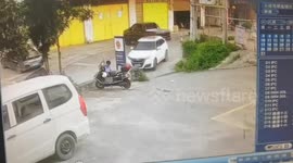 Police officer sprayed as car drives over water bottle