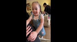 Little girl playfully taps author in New York, USA