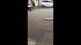 Heavy rain causes shallow street flooding in Numata, Japan