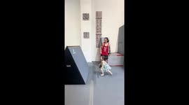 Toddler demonstrates her parkour skills with coach’s help