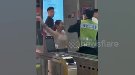 Female passenger detained over attack on subway security guard