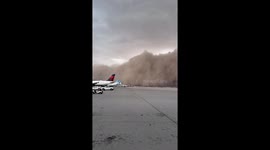 Massive Dust Storm Rolls in as Plane Takes Off
