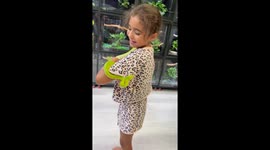Rainbow Good Eye the snake climbs on little girl in Montana, USA