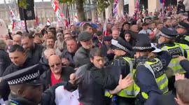 Police, protesters clash at anti-immigration rally in London led by Tommy Robinson