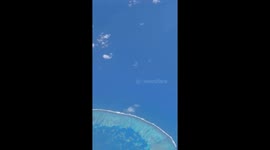 Atoll Seen From an Airplane Window