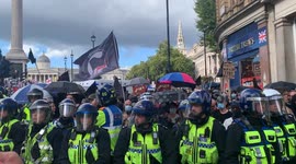Anti-fascists protestors are kettled by the police in Trafalgar Square to protect them from right wing protestors