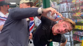 Right wing protester has police pepper spray washed out of his eyes after clashes with the police