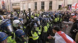 Friendly Fire! Man hit on the head by traffic cone hurled by fellow protester during CLASHES at Tommy Robinson demo