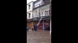 Stranded residents rescued with ladders during Bali floods