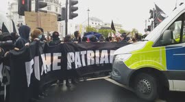 Police trying to contain the Antifa protesters during clashes with Tommy Robinson supporters from the Unite The Kingdom march