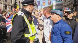 Unite The Kingdom March: Tommy Robinson supporters argue with police officer