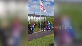 UK: Crowds gather outside hotel housing Afghans with 'ban foreign criminals' sign