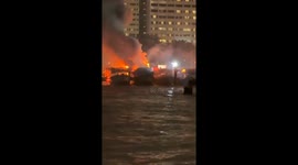 Three wooden ferries catch fire at bustling tourist spot in Thailand