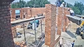 Construction site mishap sees loader send worker crashing into brick wall