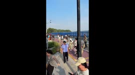 Wave crashes into sea defence sending tourists running