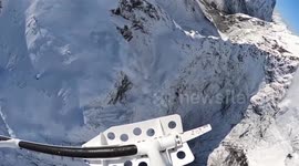 Avalanche seen from helicopter crashing down mountain in New Zealand