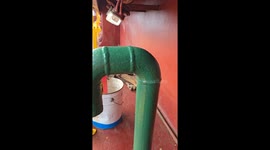 Seaman finds a hidden place on the deck to have a nap