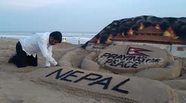 Sand artist makes mural praying for peace amid Nepal protests
