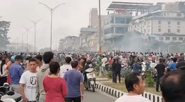 Buildings burn as crowds clash with police during Nepal protests
