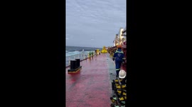 Wave crashes onto cargo ship crossing the Indian Ocean