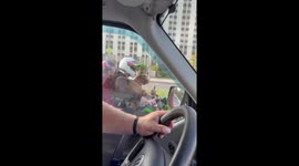 Dog rides motorcycle with owner in Moscow, Russia