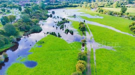 Drone footage shows Rive Ure bursting its banks sending floodwater into surrounding fields