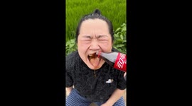 Woman's face turns bright red during guess the drink game with friend