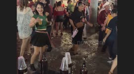 Mexicans shout out their independence by dancing in the rainwater inside the traditional Mexican cantina Club Obregon in Hermosillo, Sonora, Mexico.