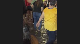 Mexicans shout the cry of independence by dancing drunkenly in the rainwater at the traditional Mexican bar Club Obregon in Hermosillo, Sonora, Mexico.