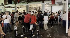 Locals dance in ankle-deep floodwater as they celebrate Mexican Independence Day
