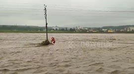 Electric pole becomes lifeline as man caught in rising river waters, rescued after 2-hour marathon effort