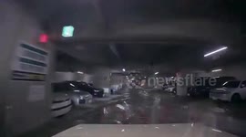 Japan: Dashcam Shows Inundated Underground Parking Lot After Torrential Rain