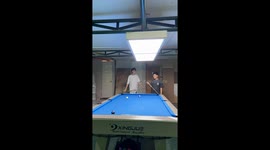 Pool player pots the black with this impressive trick shot